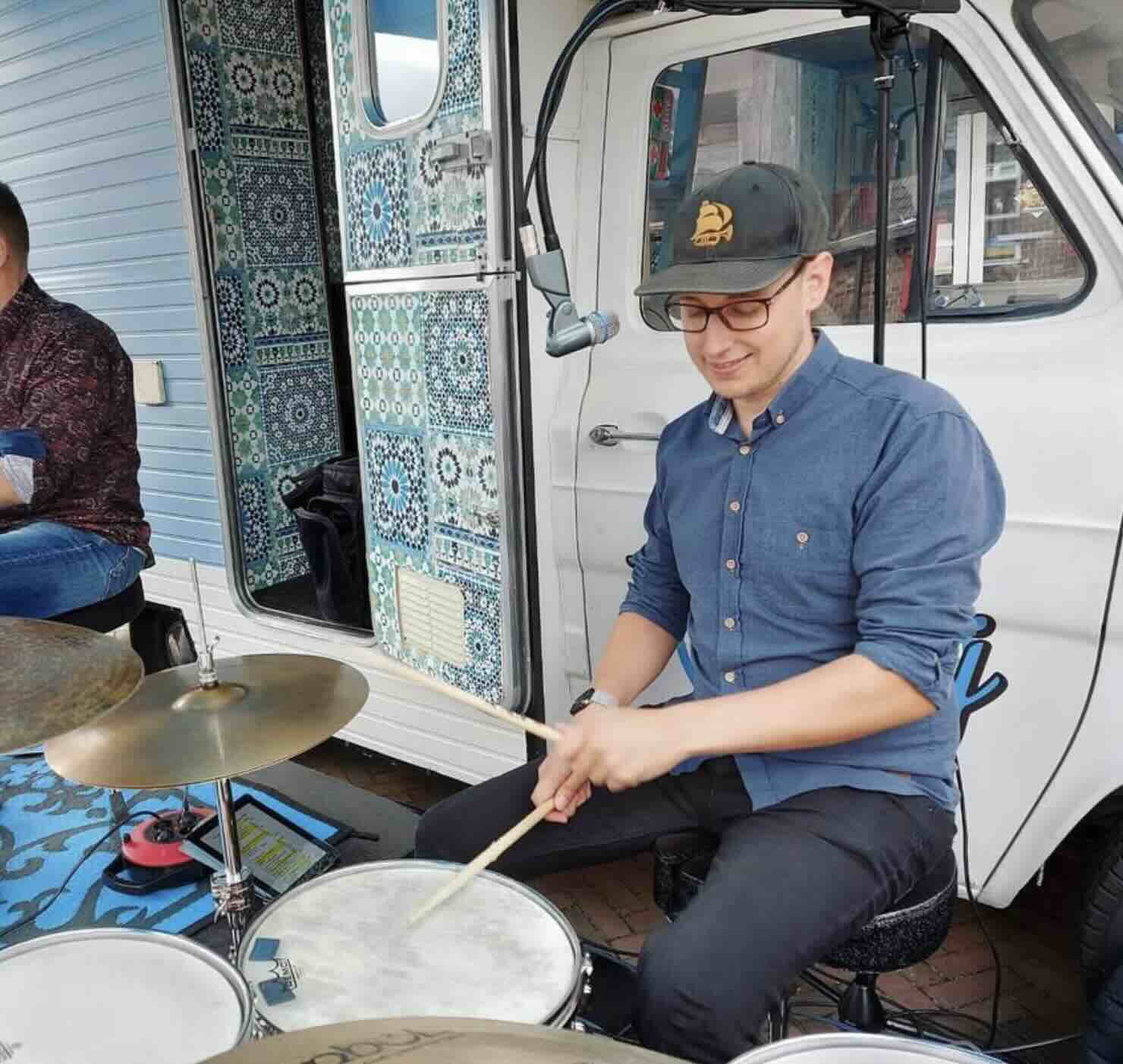 Photo of Dirk drumming with the Soultriggers